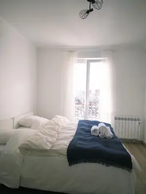 Un ou plusieurs lits dans un hébergement de l'établissement Comfortable 64 m2 Apt near Stade de France Self Check in