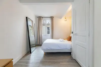 Un ou plusieurs lits dans un hébergement de l'établissement Escapade Parisienne au Cœur d'un Quartier Mythique