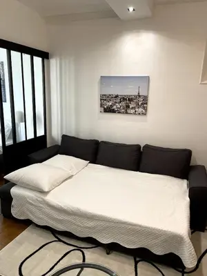 Un ou plusieurs lits dans un hébergement de l'établissement Superbe Appartement Palais Des Congres