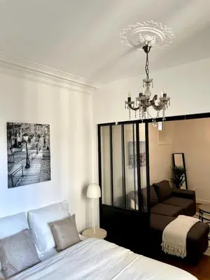 Un ou plusieurs lits dans un hébergement de l'établissement Superbe Appartement Palais Des Congres