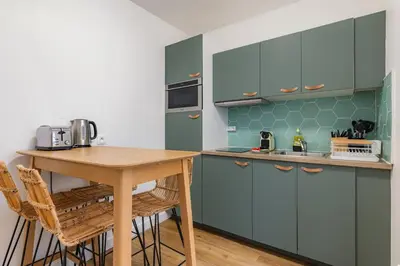Cuisine ou kitchenette dans l'établissement Cosy & Central Votre Cocon au Cœur de Paris