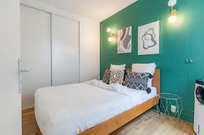 Un ou plusieurs lits dans un hébergement de l'établissement Cosy & Central Votre Cocon au Cœur de Paris