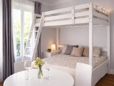 Un ou plusieurs lits dans un hébergement de l'établissement Bright Guest Suite by Place de la Bastille Marais