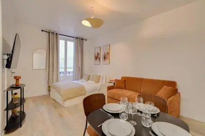 Coin salon dans l'établissement Studio confortable pour 4 au cœur de Paris