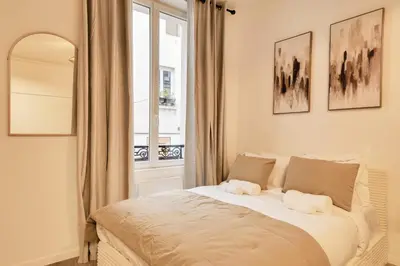 Un ou plusieurs lits dans un hébergement de l'établissement Studio confortable pour 4 au cœur de Paris