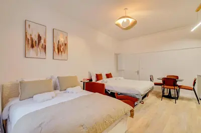 Un ou plusieurs lits dans un hébergement de l'établissement Studio confortable pour 4 au cœur de Paris
