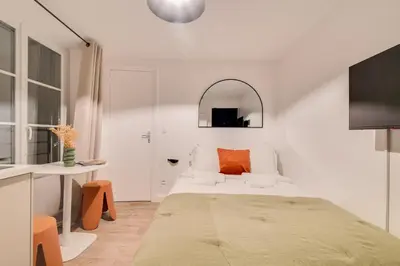 Un ou plusieurs lits dans un hébergement de l'établissement Studio confortable au cœur de Paris