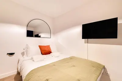 Un ou plusieurs lits dans un hébergement de l'établissement Studio confortable au cœur de Paris