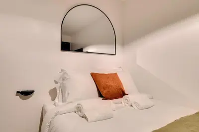Un ou plusieurs lits dans un hébergement de l'établissement Studio confortable au cœur de Paris