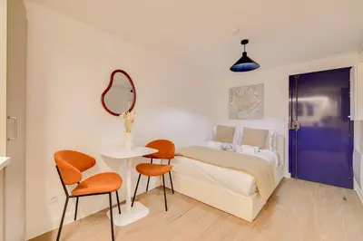 Un ou plusieurs lits dans un hébergement de l'établissement Studio parisien cosy et bien équipé