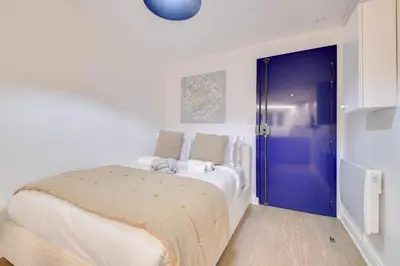 Un ou plusieurs lits dans un hébergement de l'établissement Studio parisien cosy et bien équipé