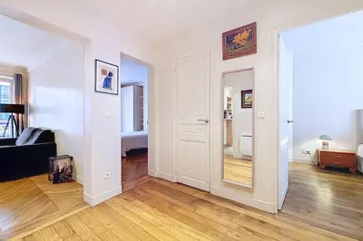 Un ou plusieurs lits dans un hébergement de l'établissement Appartement haussmannien près de lArc de Triomphe