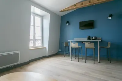 Télévision ou salle de divertissement dans l'établissement Résidence Bastille Liberty