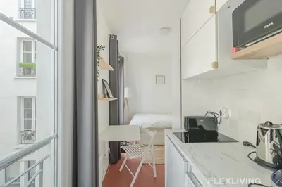 Cuisine ou kitchenette dans l'établissement Studio 5min Gare de lEst quartier animé & culturel