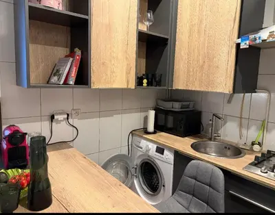 Cuisine ou kitchenette dans l'établissement Cozy apartment - quiet and greenery nearby