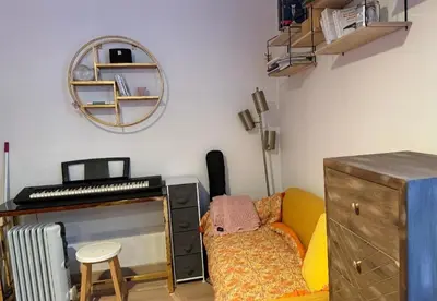 Coin salon dans l'établissement Cozy apartment - quiet and greenery nearby