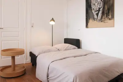 Un ou plusieurs lits dans un hébergement de l'établissement Appartement lumineux à Boulogne-Billancourt