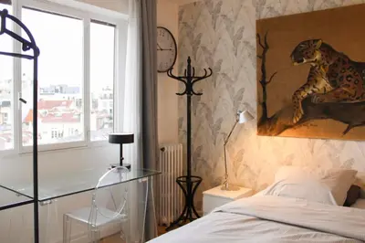 Un ou plusieurs lits dans un hébergement de l'établissement Appartement lumineux à Boulogne-Billancourt
