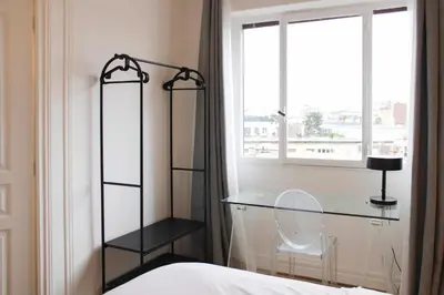 Un ou plusieurs lits dans un hébergement de l'établissement Appartement lumineux à Boulogne-Billancourt