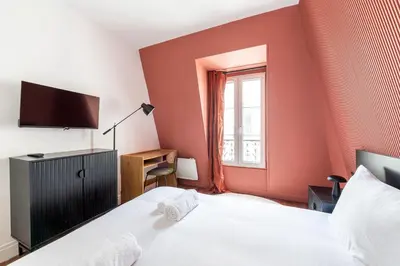 Un ou plusieurs lits dans un hébergement de l'établissement Central Apartment - Near the Champs-Élysées