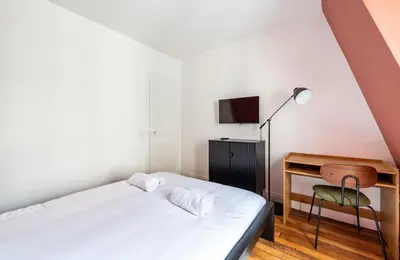 Un ou plusieurs lits dans un hébergement de l'établissement Central Apartment - Near the Champs-Élysées