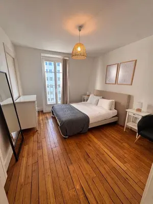 Un ou plusieurs lits dans un hébergement de l'établissement Magnifique appartement avec vue sur la Tour Eiffel