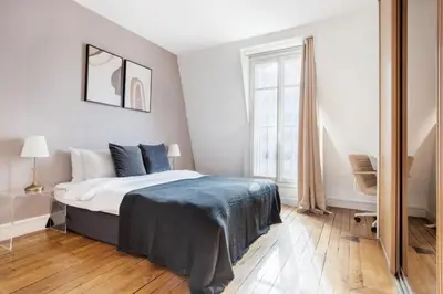 Un ou plusieurs lits dans un hébergement de l'établissement Magnifique appartement avec vue sur la Tour Eiffel