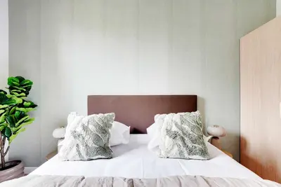 Un ou plusieurs lits dans un hébergement de l'établissement Cozy Apartment 1BR-3P - Ivry