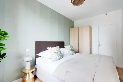 Un ou plusieurs lits dans un hébergement de l'établissement Cozy Apartment 1BR-3P - Ivry