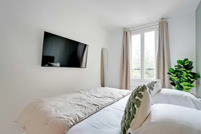 Un ou plusieurs lits dans un hébergement de l'établissement Cozy Apartment 1BR-3P - Ivry