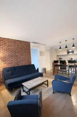 Coin salon dans l'établissement Appartement chic près du Champ-de-Mars