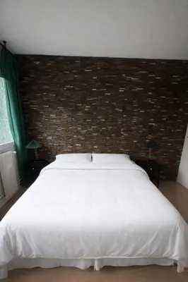 Un ou plusieurs lits dans un hébergement de l'établissement Appartement chic près du Champ-de-Mars