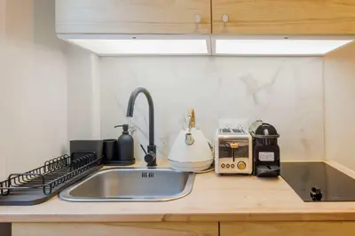 Cuisine ou kitchenette dans l'établissement 2P studio on the rooftops of Paris