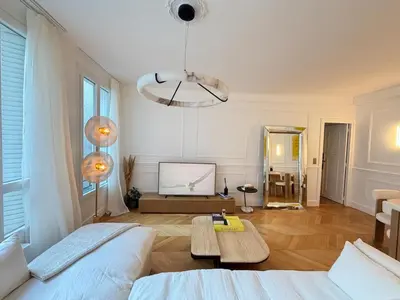 Un ou plusieurs lits dans un hébergement de l'établissement Elegant 2 Bedrooms Parisian Flat & Chic in Neuilly