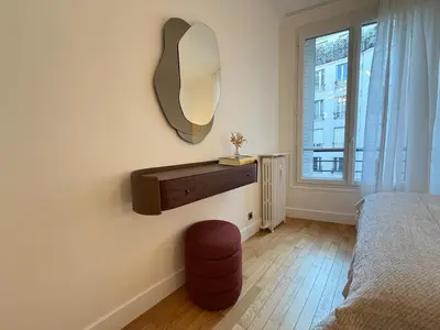 Un ou plusieurs lits dans un hébergement de l'établissement Elegant 2 Bedrooms Parisian Flat & Chic in Neuilly