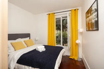Un ou plusieurs lits dans un hébergement de l'établissement Appartement familial proche de la Tour Eiffel