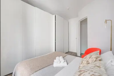 Un ou plusieurs lits dans un hébergement de l'établissement Serenty - 2BR - Le Louvre & Saint Germain