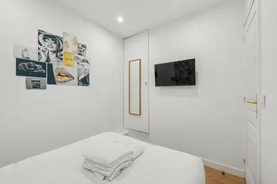 Un ou plusieurs lits dans un hébergement de l'établissement Design apartment Avenue des Champs Elysées