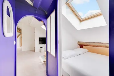 Un ou plusieurs lits dans un hébergement de l'établissement Modern Apartment 1BR 2P - Paris 2