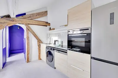 Cuisine ou kitchenette dans l'établissement Modern Apartment 1BR 2P - Paris 2