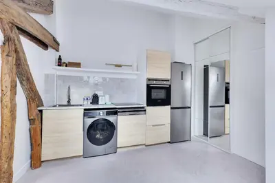 Cuisine ou kitchenette dans l'établissement Modern Apartment 1BR 2P - Paris 2