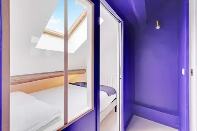 Un ou plusieurs lits dans un hébergement de l'établissement Modern Apartment 1BR 2P - Paris 2