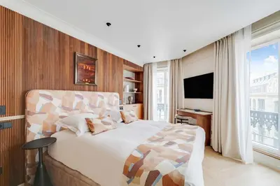 Un ou plusieurs lits dans un hébergement de l'établissement Charming apartment a c 2BR-6P Grand boulevards