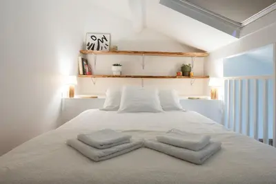 Un ou plusieurs lits dans un hébergement de l'établissement Apparemment Duplex proche Zénith de Paris