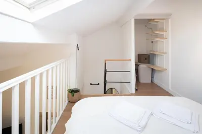 Un ou plusieurs lits dans un hébergement de l'établissement Apparemment Duplex proche Zénith de Paris