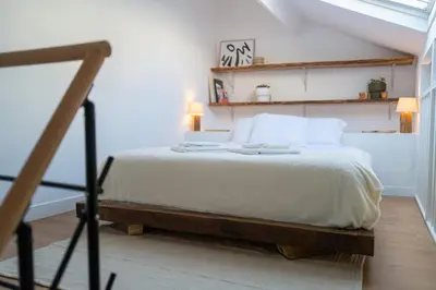 Un ou plusieurs lits dans un hébergement de l'établissement Apparemment Duplex proche Zénith de Paris