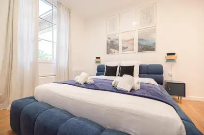 Un ou plusieurs lits dans un hébergement de l'établissement Marais Paris Appartement familial 2 chambres