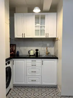 Cuisine ou kitchenette dans l'établissement Paris Studio - Stay near Eiffel Tower