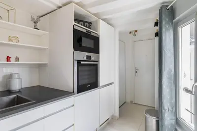 Cuisine ou kitchenette dans l'établissement Appartement Cosy metro saint paul - 4P - Paris 4