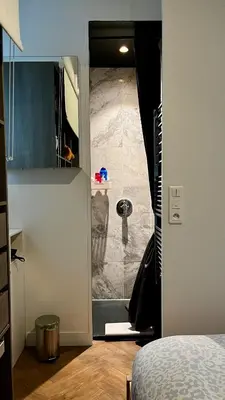 Télévision ou salle de divertissement dans l'établissement Appartement élégant à cœur de Paris 2ème
